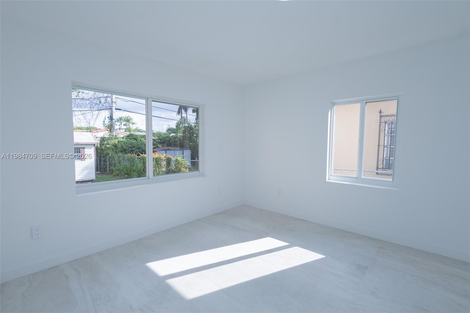 2675 Southwest 24th Terrace Miami, FL 33145 - Photo 19 of 36 an empty room with a window