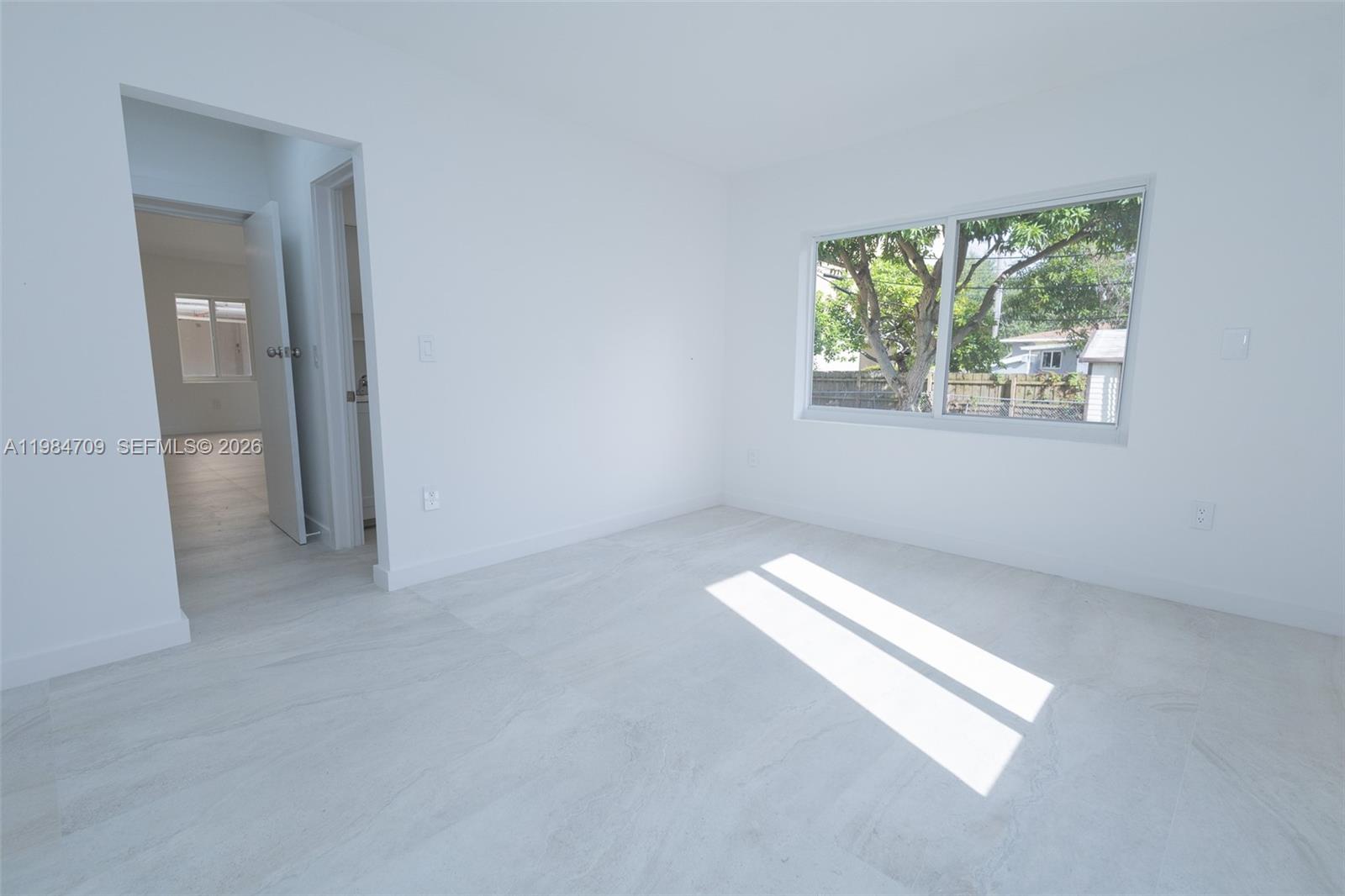 2675 Southwest 24th Terrace Miami, FL 33145 - Photo 20 of 36 an empty room with windows