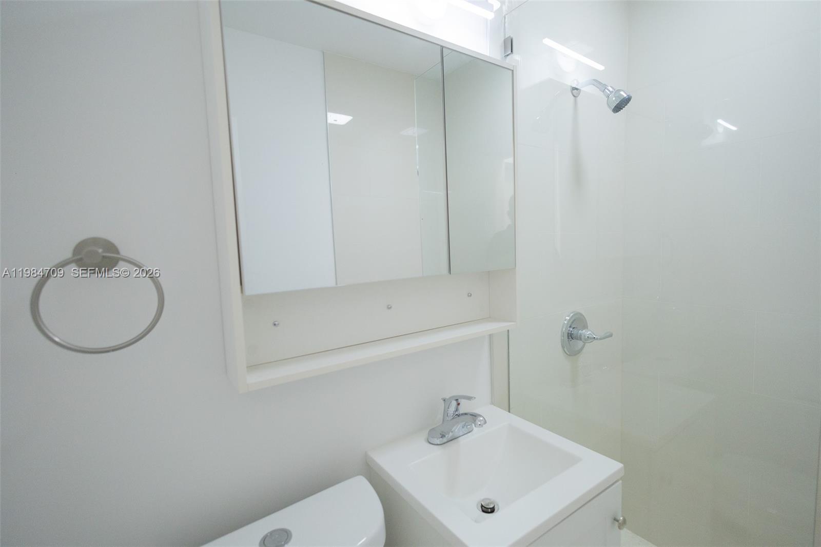 2675 Southwest 24th Terrace Miami, FL 33145 - Photo 26 of 36 a bathroom with a sink a toilet and shower