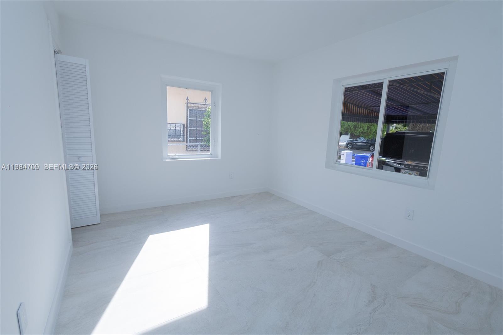 2675 Southwest 24th Terrace Miami, FL 33145 - Photo 27 of 36 an empty room with windows