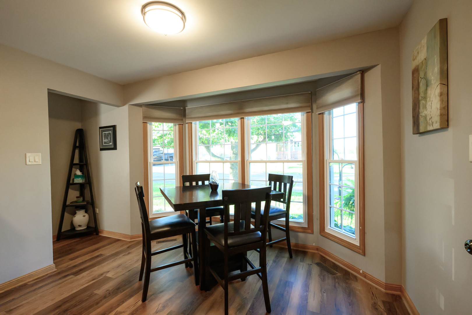 10111 Cambridge Drive, Unit COURTG Mokena, IL 60448 - Photo 13 of 31 a view of a dining room with furniture and wooden floor