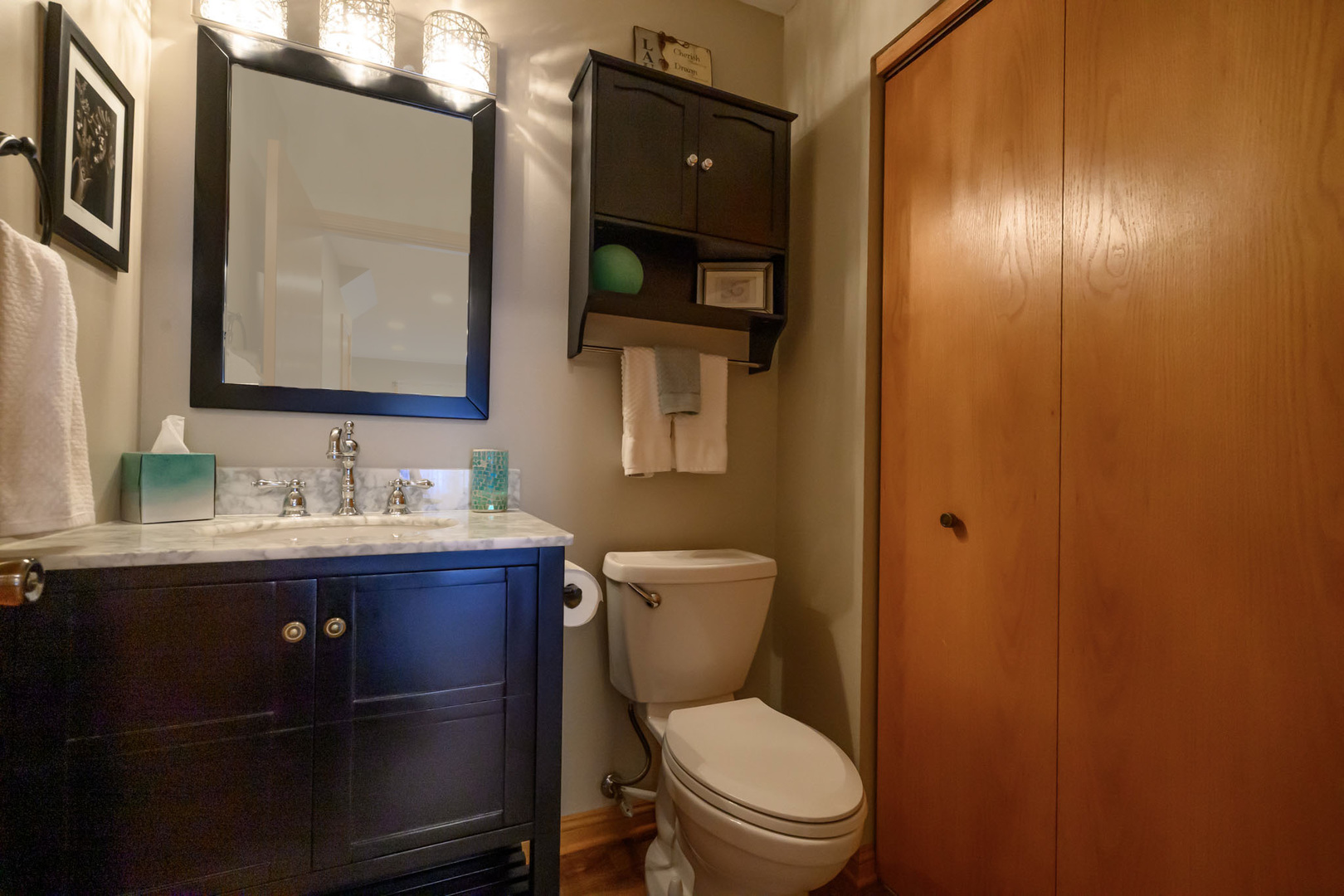 10111 Cambridge Drive, Unit COURTG Mokena, IL 60448 - Photo 14 of 31 a bathroom with a toilet sink and mirror