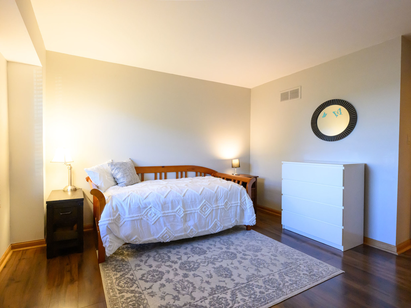 10111 Cambridge Drive, Unit COURTG Mokena, IL 60448 - Photo 21 of 31 a bedroom with a bed and a lamp on dresser