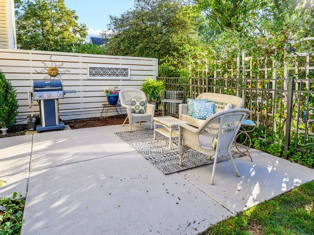 a view of a patio with two chairs and a table