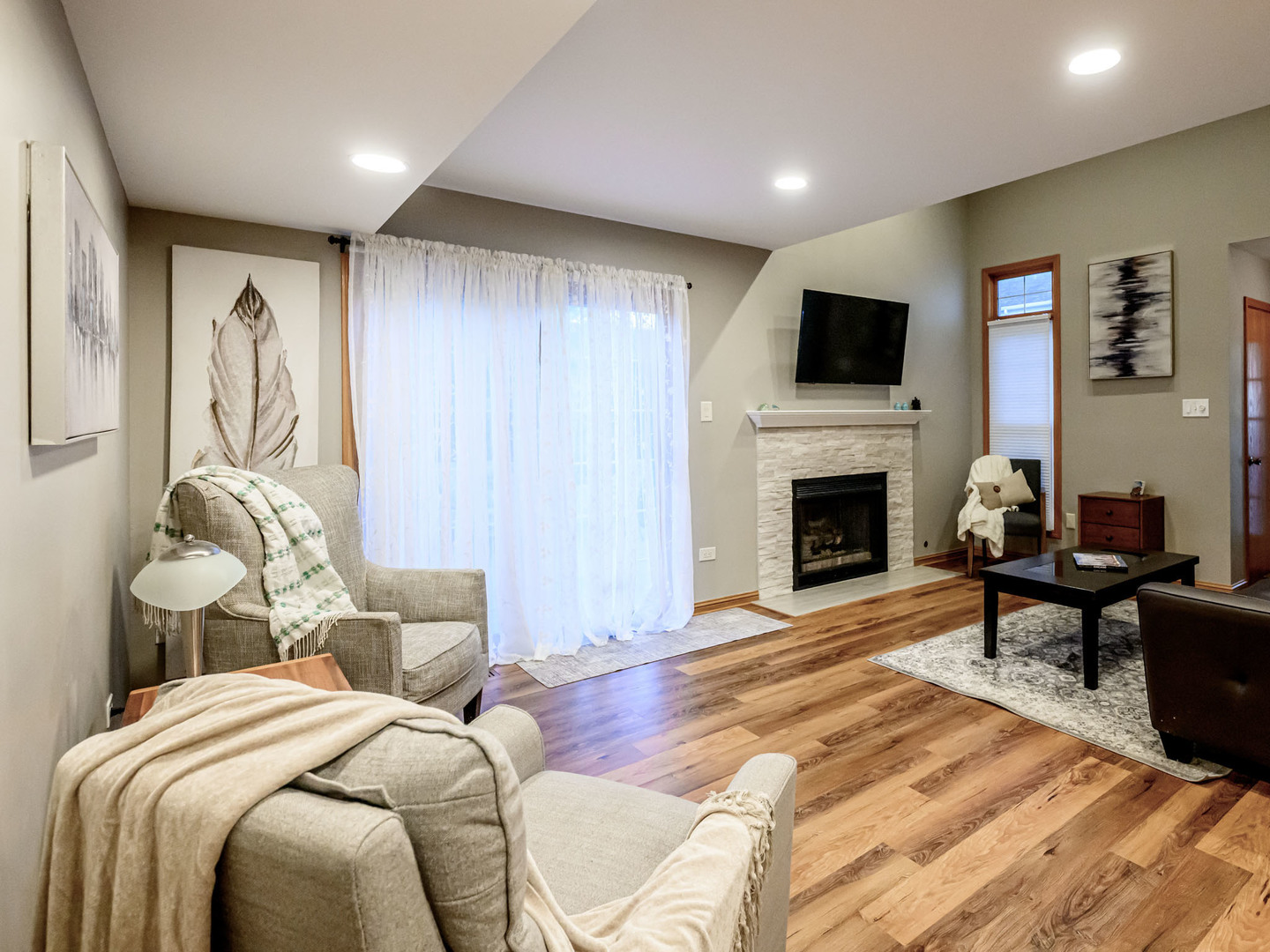 10111 Cambridge Drive, Unit COURTG Mokena, IL 60448 - Photo 3 of 31 a spacious bedroom with a bed and a television
