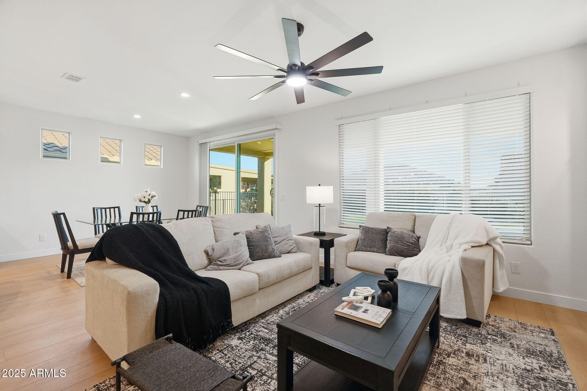 8159 West Cinder Brook Way Florence, AZ 85132 - Photo 15 of 32 a living room with furniture and a large window