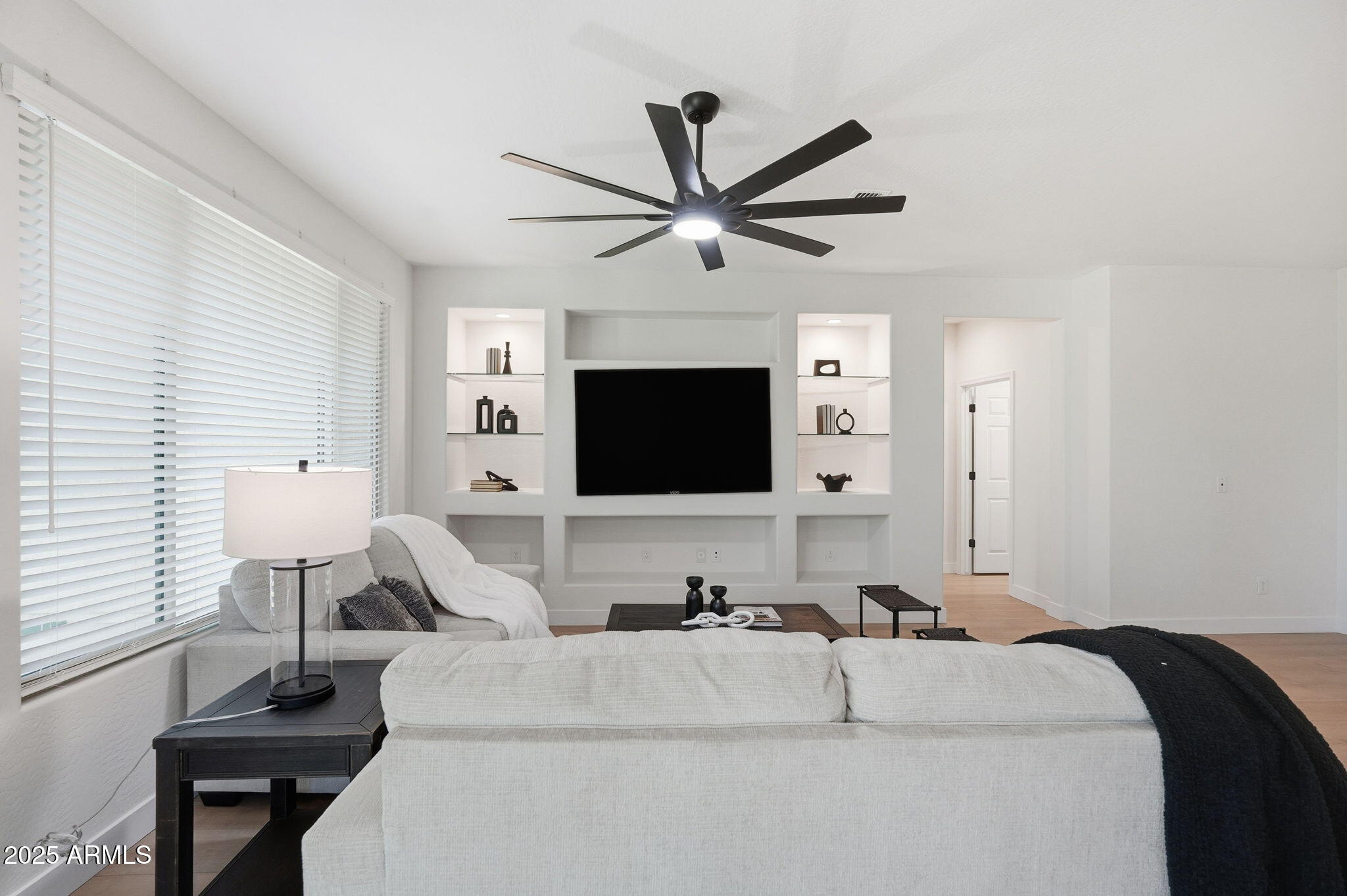 8159 West Cinder Brook Way Florence, AZ 85132 - Photo 16 of 32 a living room with furniture and a flat screen tv