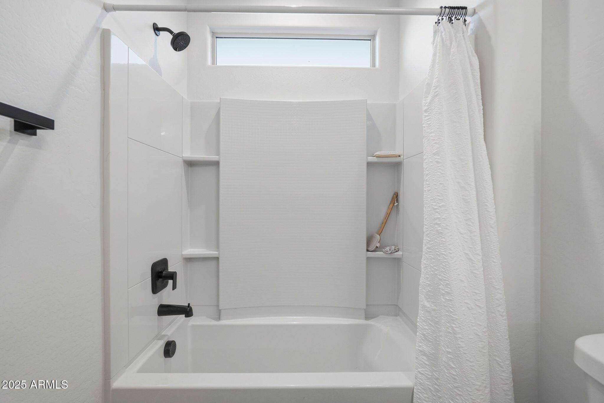 8159 West Cinder Brook Way Florence, AZ 85132 - Photo 21 of 32 a bathroom with a bathtub