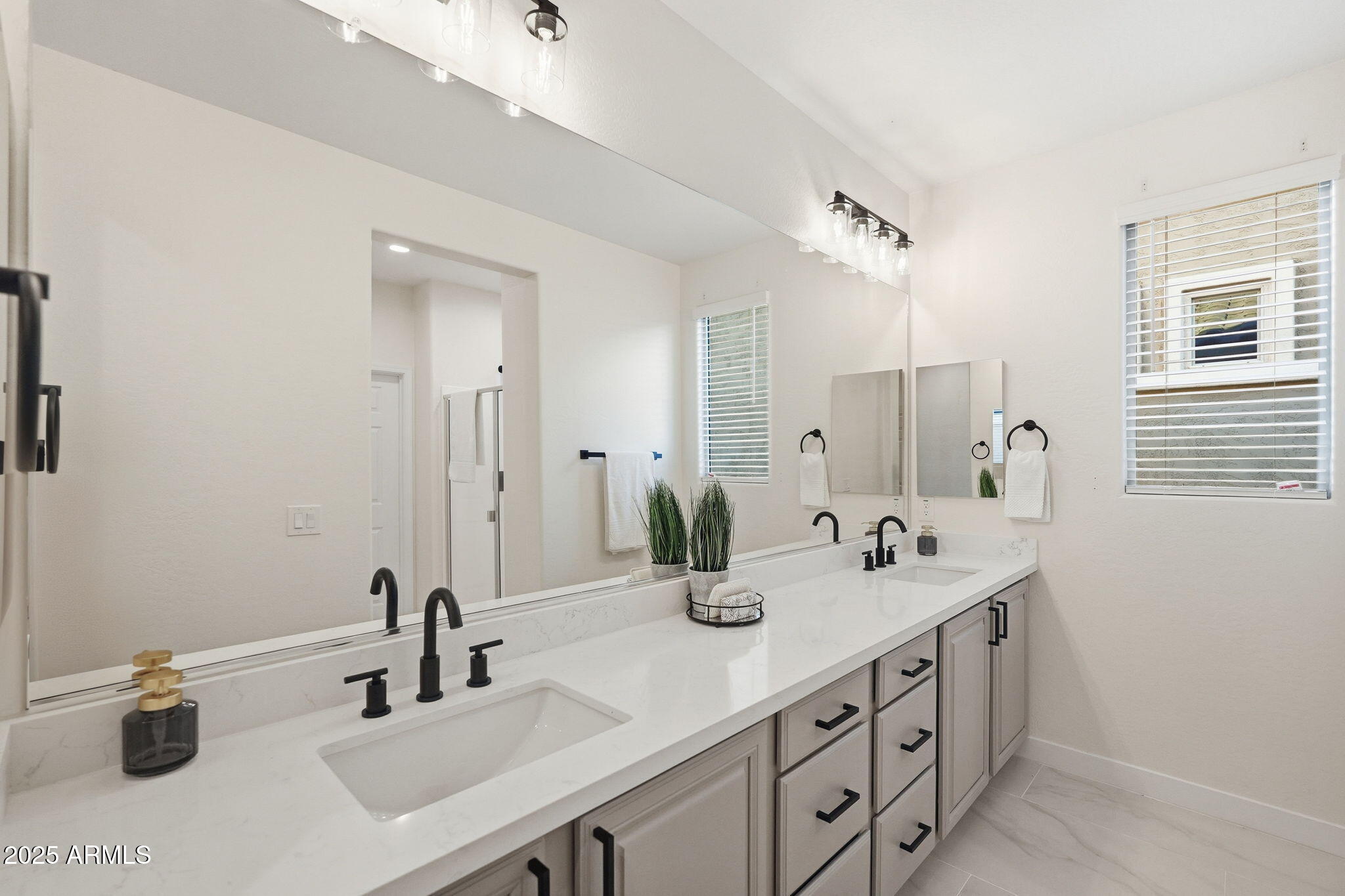 8159 West Cinder Brook Way Florence, AZ 85132 - Photo 27 of 32 a bathroom with double sink and a mirror