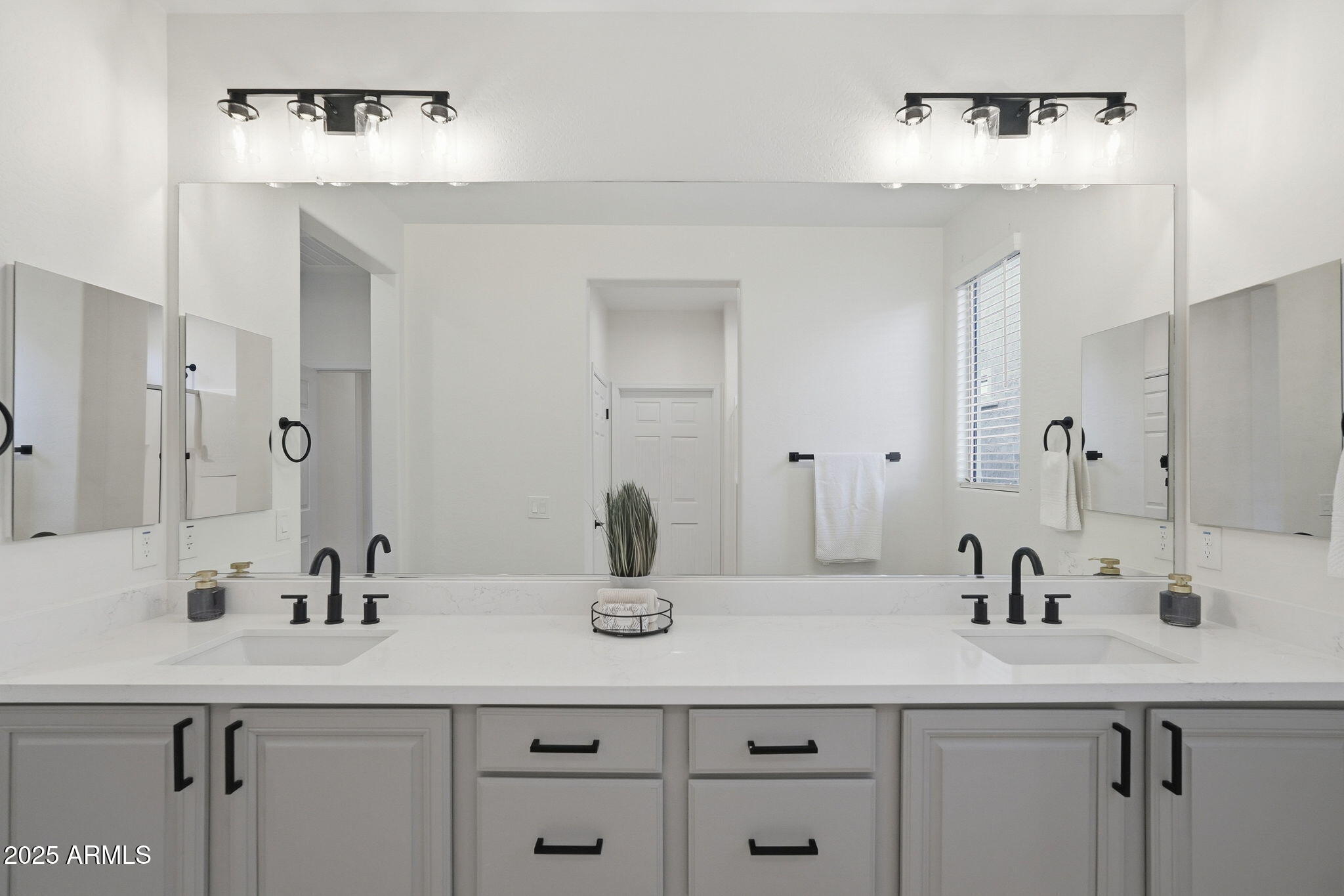 8159 West Cinder Brook Way Florence, AZ 85132 - Photo 28 of 32 a bathroom with a sink and a mirror
