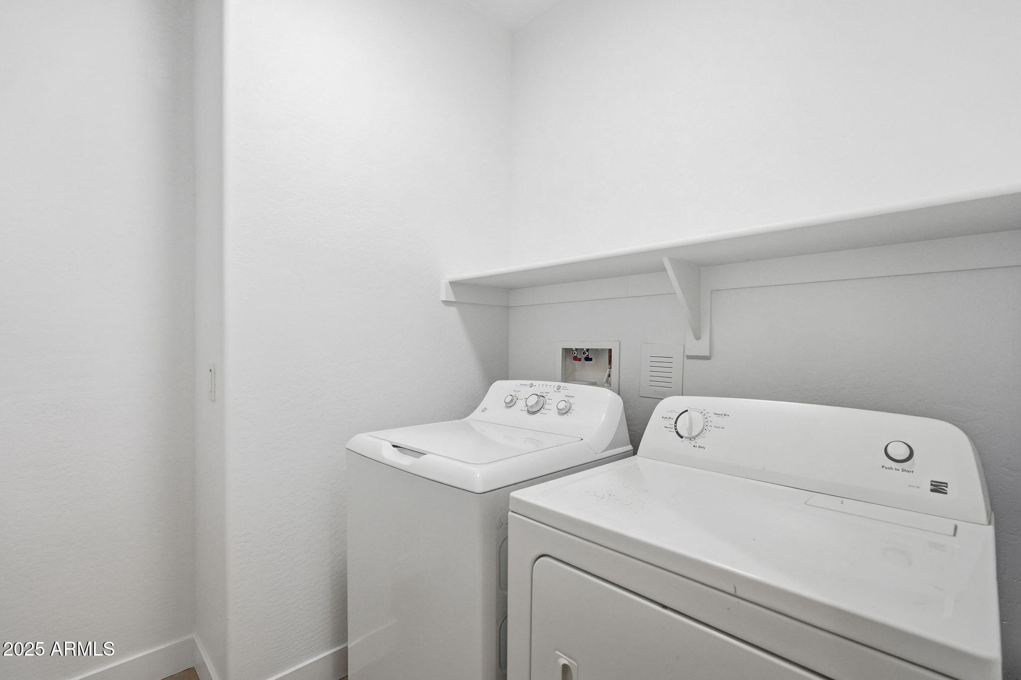 8159 West Cinder Brook Way Florence, AZ 85132 - Photo 29 of 32 a utility room with dryer and washer