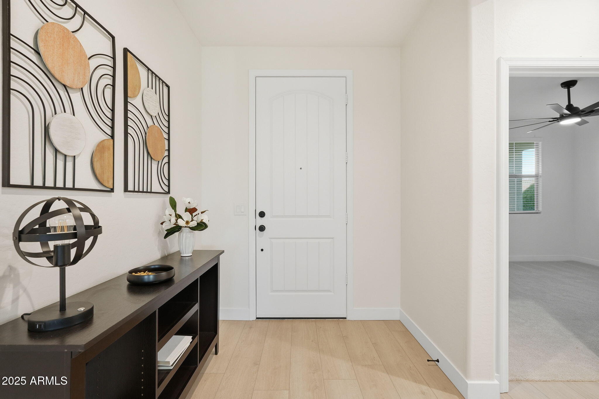 8159 West Cinder Brook Way Florence, AZ 85132 - Photo 4 of 32 a view of a hallway with entryway door
