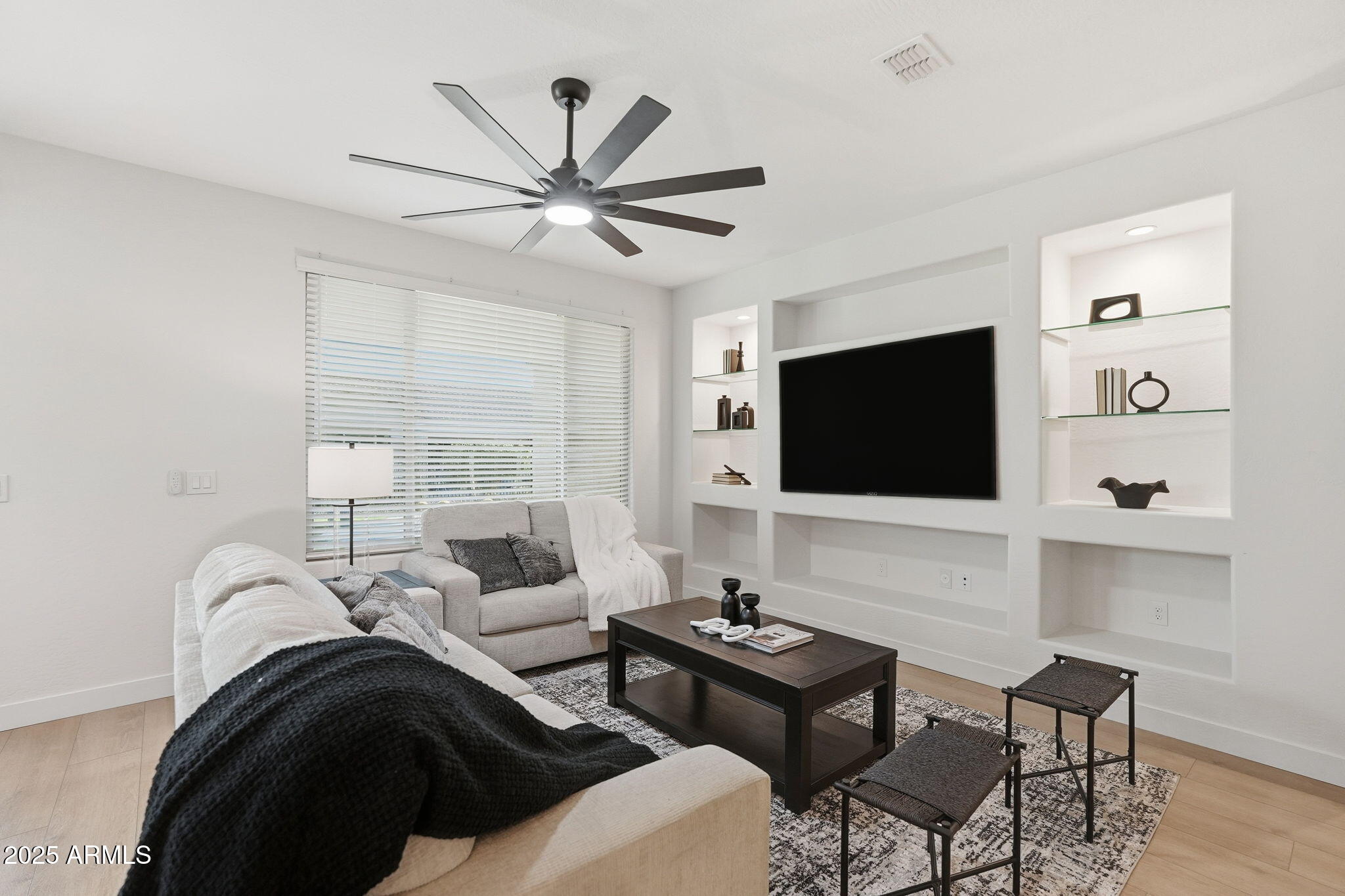 8159 West Cinder Brook Way Florence, AZ 85132 - Photo 6 of 32 a living room with furniture and a flat screen tv