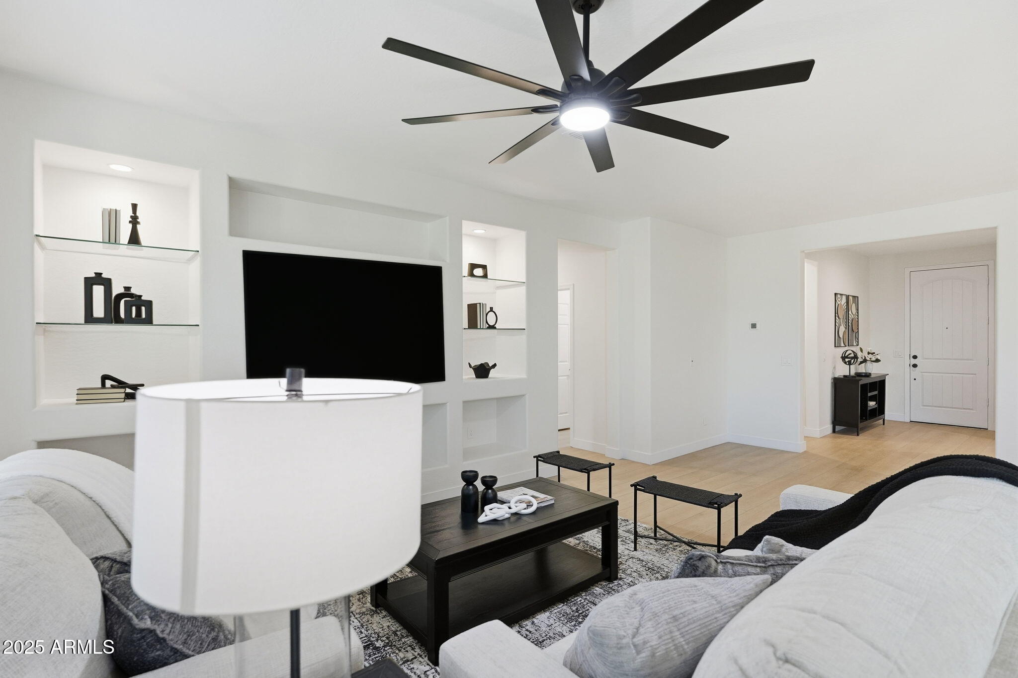 8159 West Cinder Brook Way Florence, AZ 85132 - Photo 7 of 32 a living room with furniture and a flat screen tv