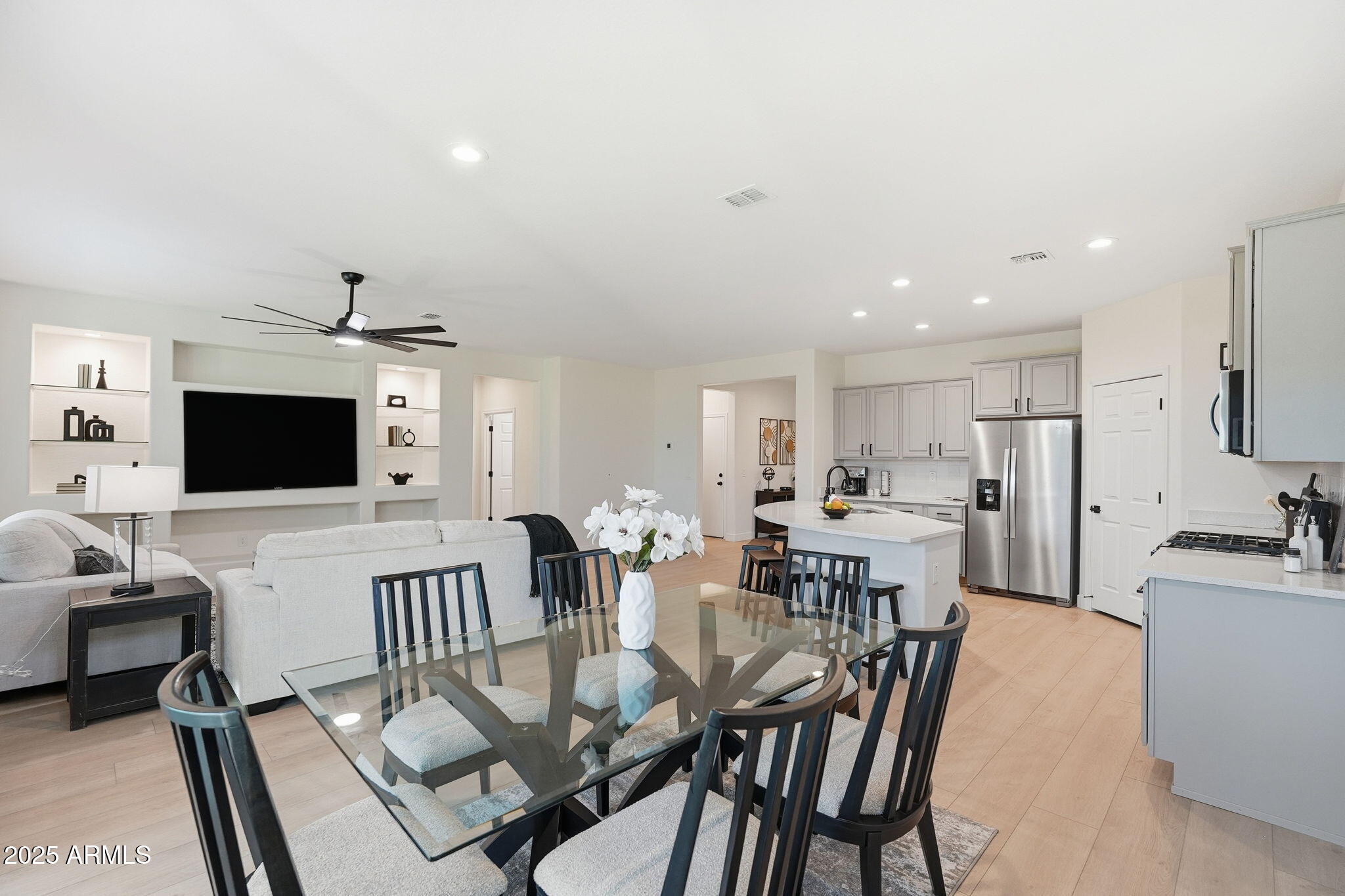 8159 West Cinder Brook Way Florence, AZ 85132 - Photo 9 of 32 a view of a dining room with furniture and wooden floor