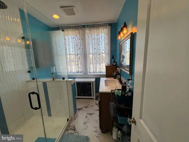 a bathroom with a sink a vanity and a mirror