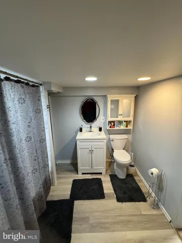 a living room with furniture a lamp and a window