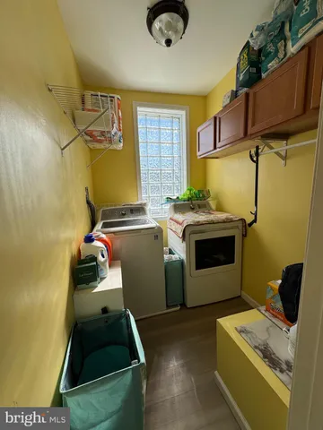 a utility room with a sink dryer and washer