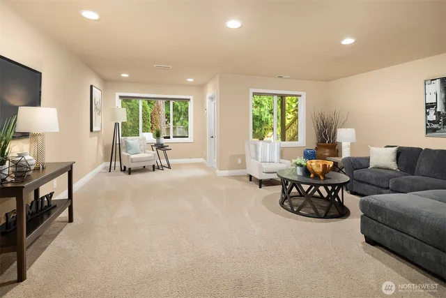 a living room with furniture and large window