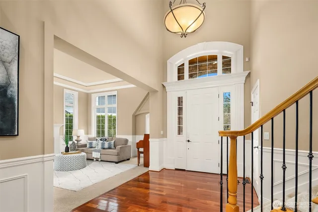 a view of livingroom with furniture wooden floor and windows