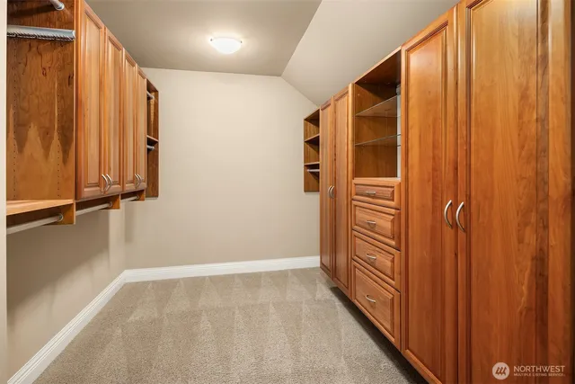 a spacious bathroom with a tub sink and mirror
