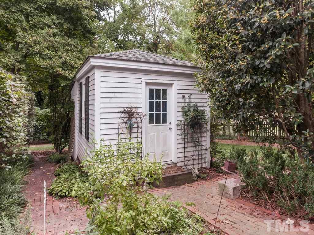 1336 Brooks Avenue Raleigh, NC 27607 - Photo 22 of 24 a view of a house with backyard and garden