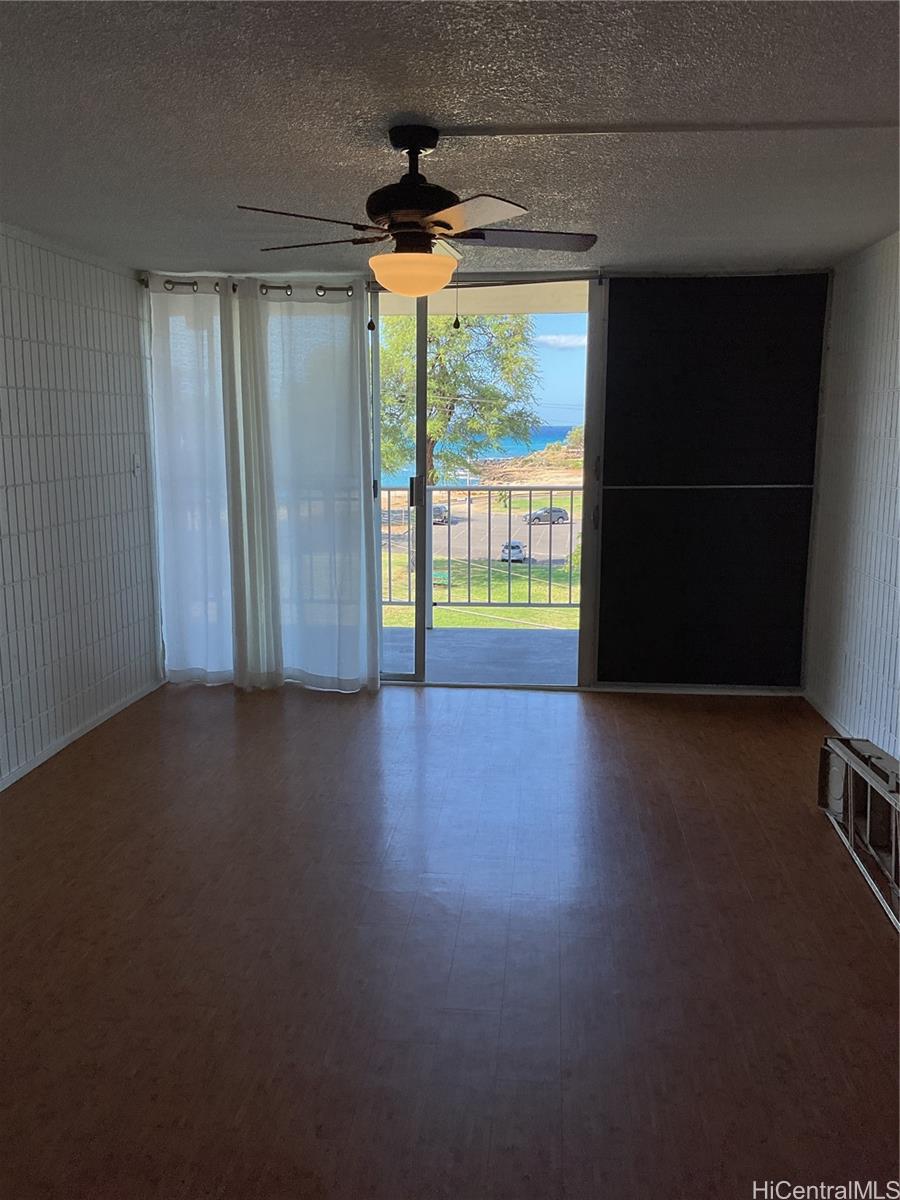 85-003 Pokai Bay Street, Unit 403 Waianae, HI 96792 - Photo 11 of 22 a view of an empty room with a window