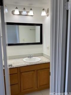 85-003 Pokai Bay Street, Unit 403 Waianae, HI 96792 - Photo 18 of 22 a bathroom with a sink and a mirror