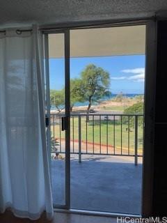 85-003 Pokai Bay Street, Unit 403 Waianae, HI 96792 - Photo 7 of 22 a view of a glass door with a yard from a window