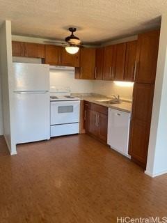 85-003 Pokai Bay Street, Unit 403 Waianae, HI 96792 - Photo 9 of 22 a kitchen with granite countertop stainless steel appliances a stove top oven cabinets a sink and a refrigerator