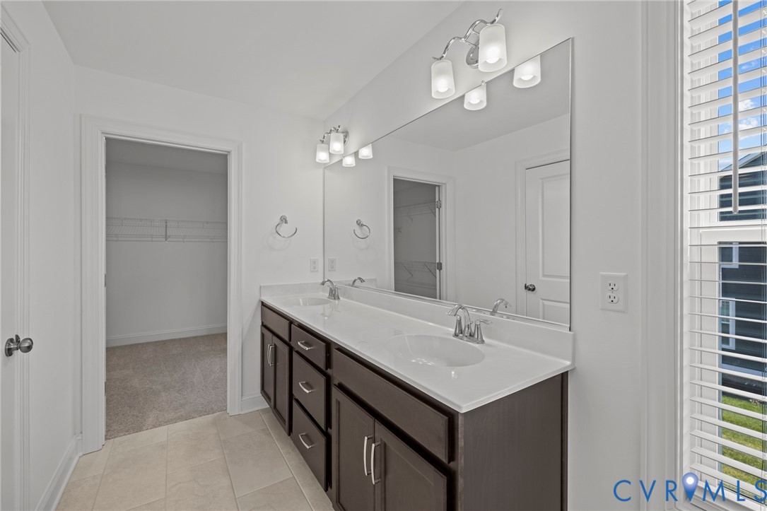 224 Lauradell Road Ashland, VA 23005 - Photo 41 of 74 Double vanity with a white countertop and dark woo