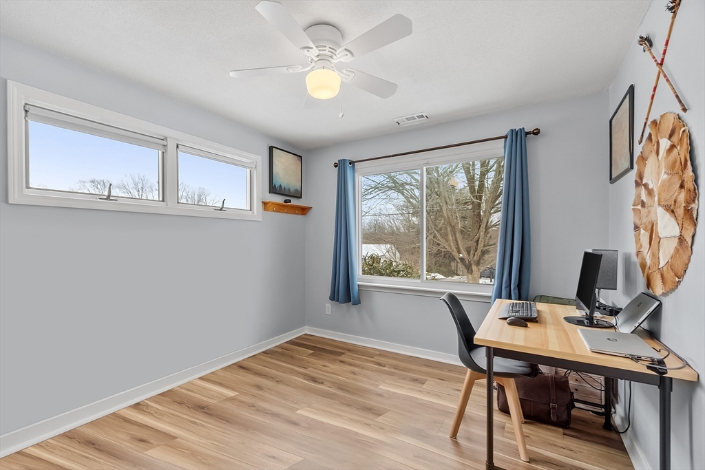 24 George Street Charlton, MA 01507 - Photo 19 of 42 a view of a workspace with furniture and a window