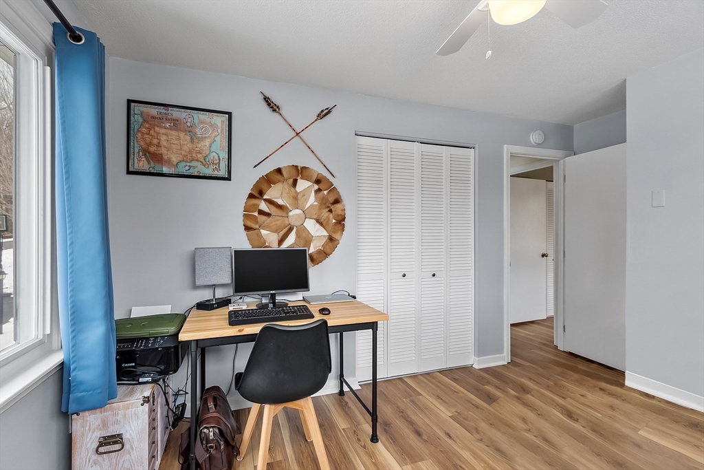 24 George Street Charlton, MA 01507 - Photo 20 of 42 a view of a workspace with furniture and wooden floor