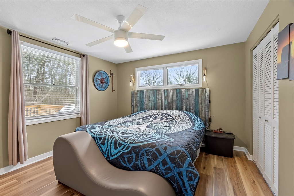 24 George Street Charlton, MA 01507 - Photo 21 of 42 a bed sitting in a bedroom next to a window