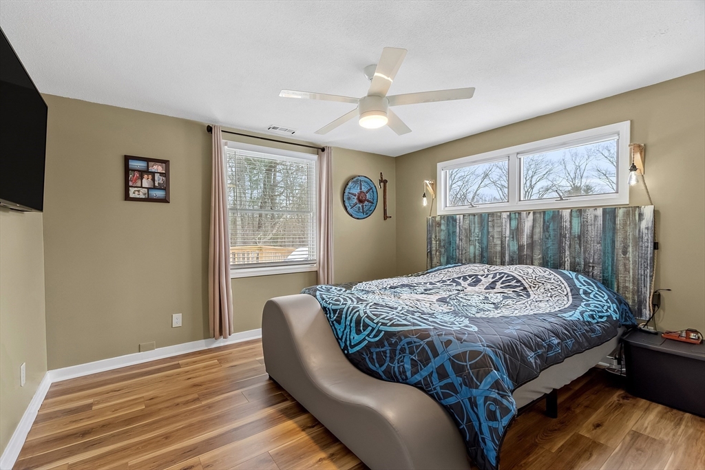 24 George Street Charlton, MA 01507 - Photo 22 of 42 a bed sitting in a bedroom next to a window