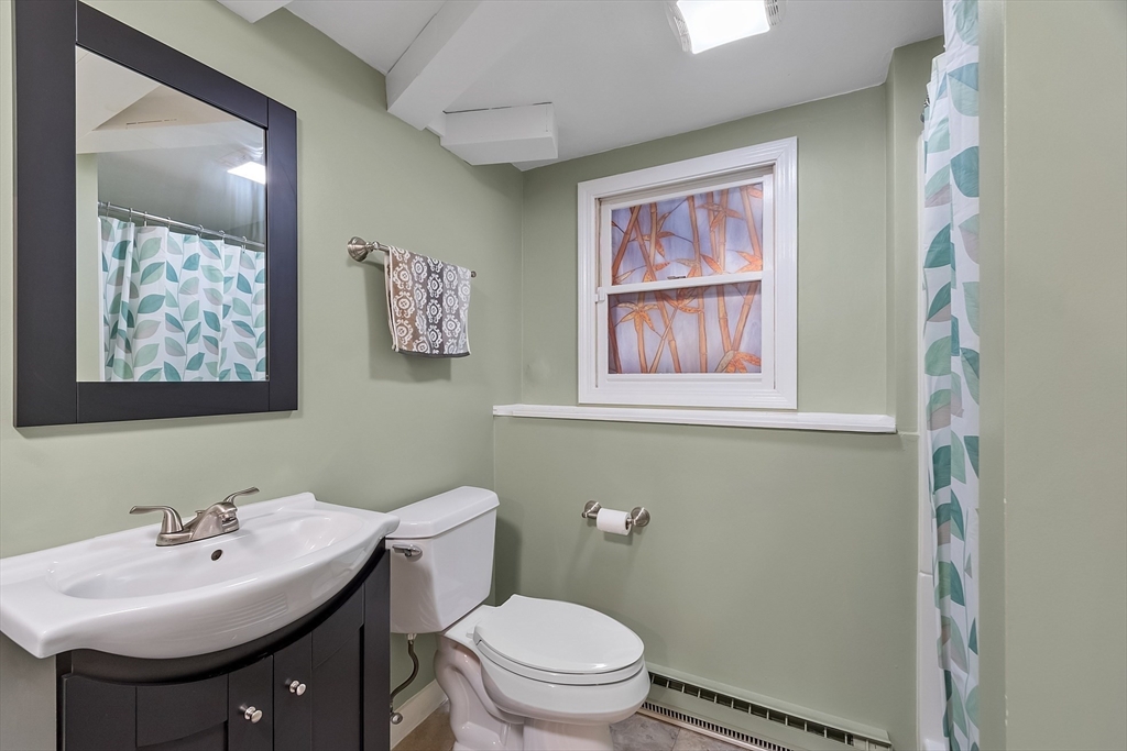 24 George Street Charlton, MA 01507 - Photo 30 of 42 a bathroom with a toilet a sink and mirror