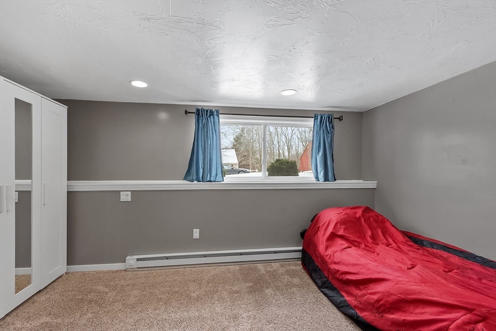 24 George Street Charlton, MA 01507 - Photo 35 of 42 wooden floor with a bed and a window