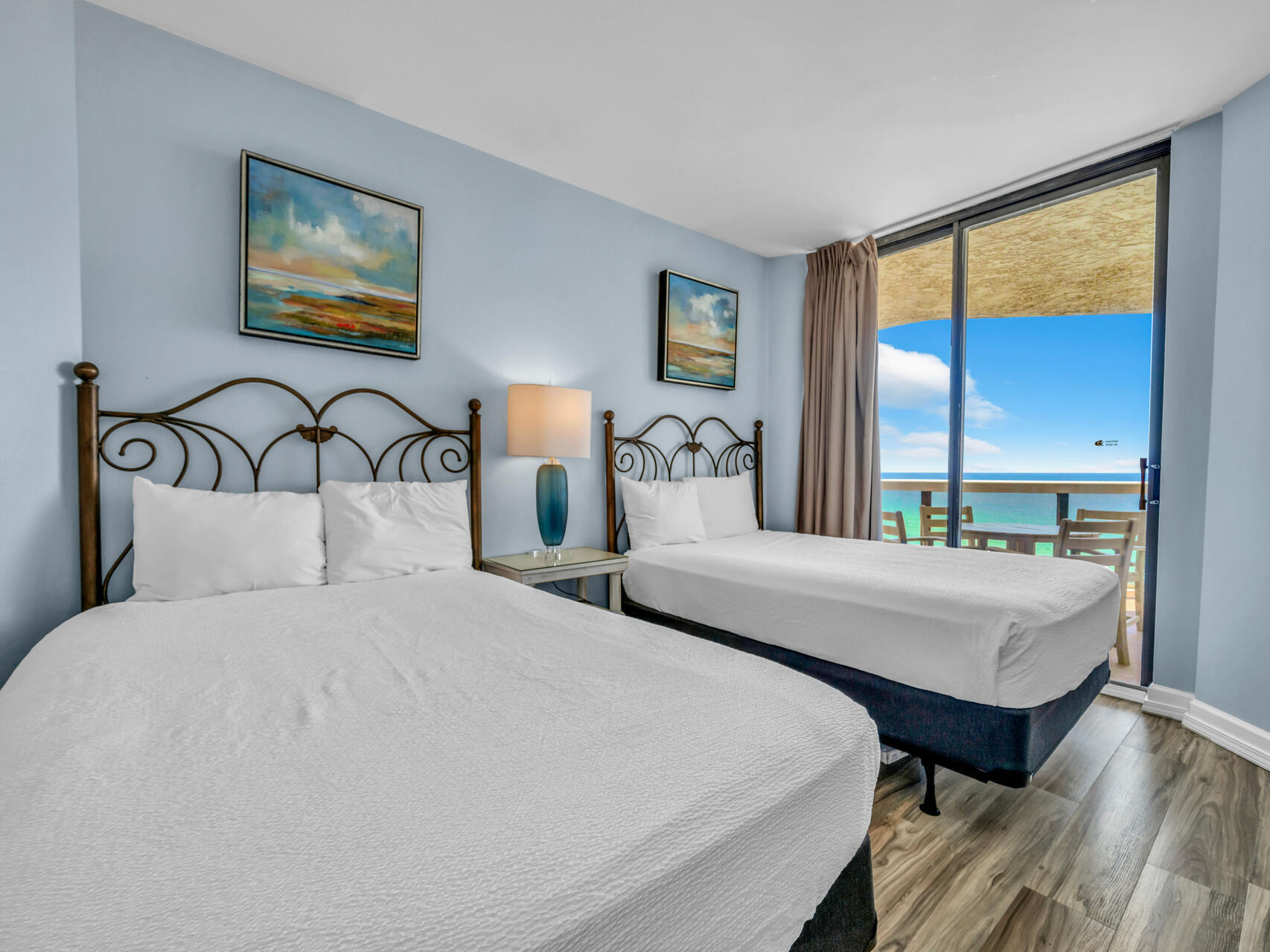 1096 Scenic Gulf Drive, Unit 1401/1401A Miramar Beach, FL 32550 - Photo 11 of 77 a bedroom with a bed and a large window