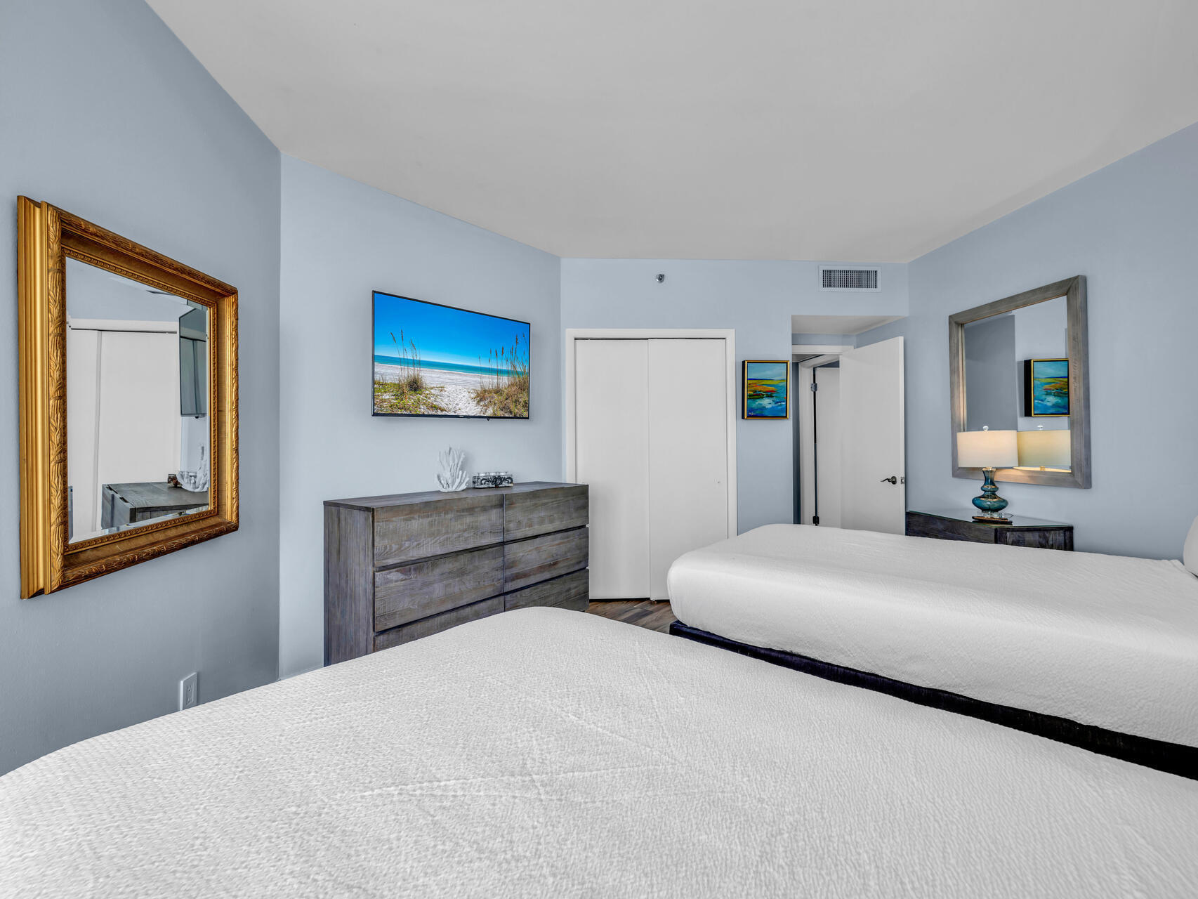 1096 Scenic Gulf Drive, Unit 1401/1401A Miramar Beach, FL 32550 - Photo 12 of 77 a bedroom with a bed and a painting on the wall