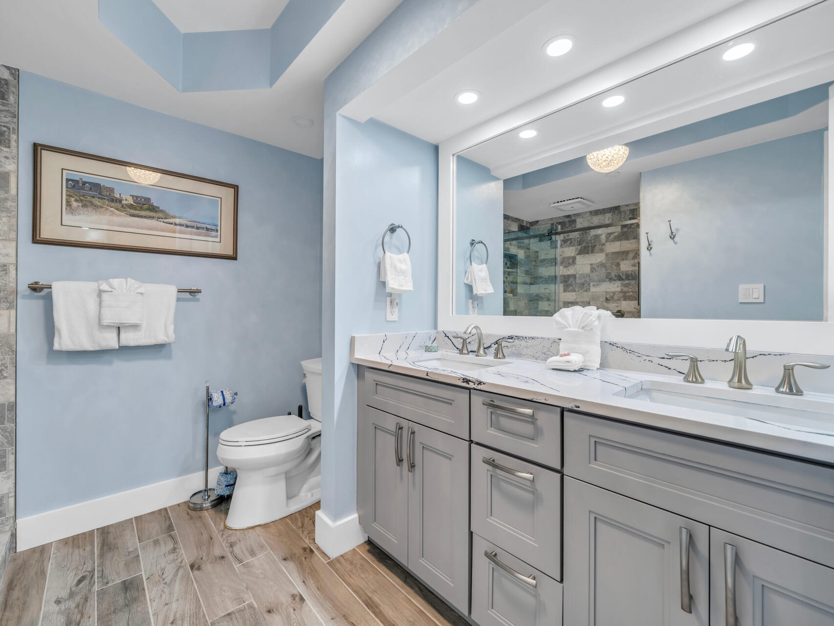 1096 Scenic Gulf Drive, Unit 1401/1401A Miramar Beach, FL 32550 - Photo 14 of 77 a bathroom with a toilet sink double vanity and mirror