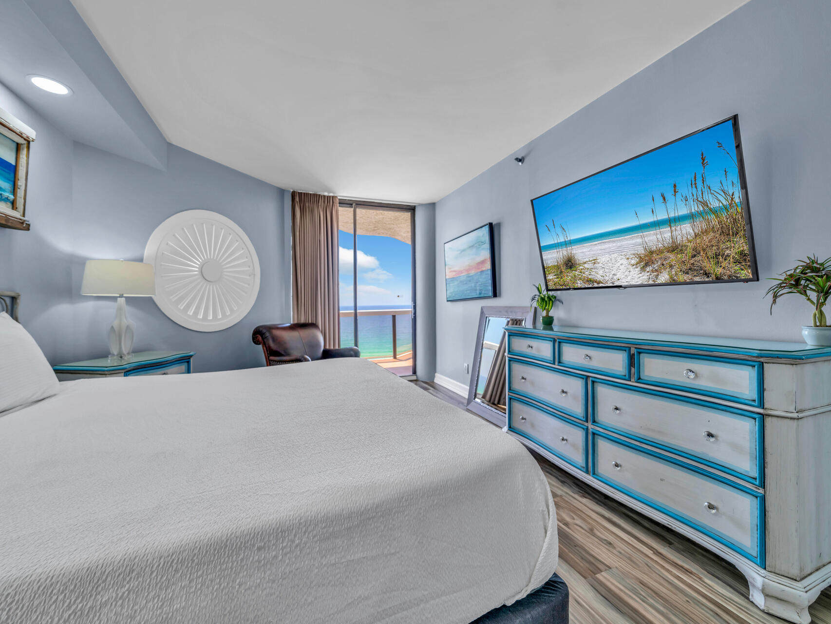 1096 Scenic Gulf Drive, Unit 1401/1401A Miramar Beach, FL 32550 - Photo 17 of 77 a bedroom with a bed and a flat screen tv