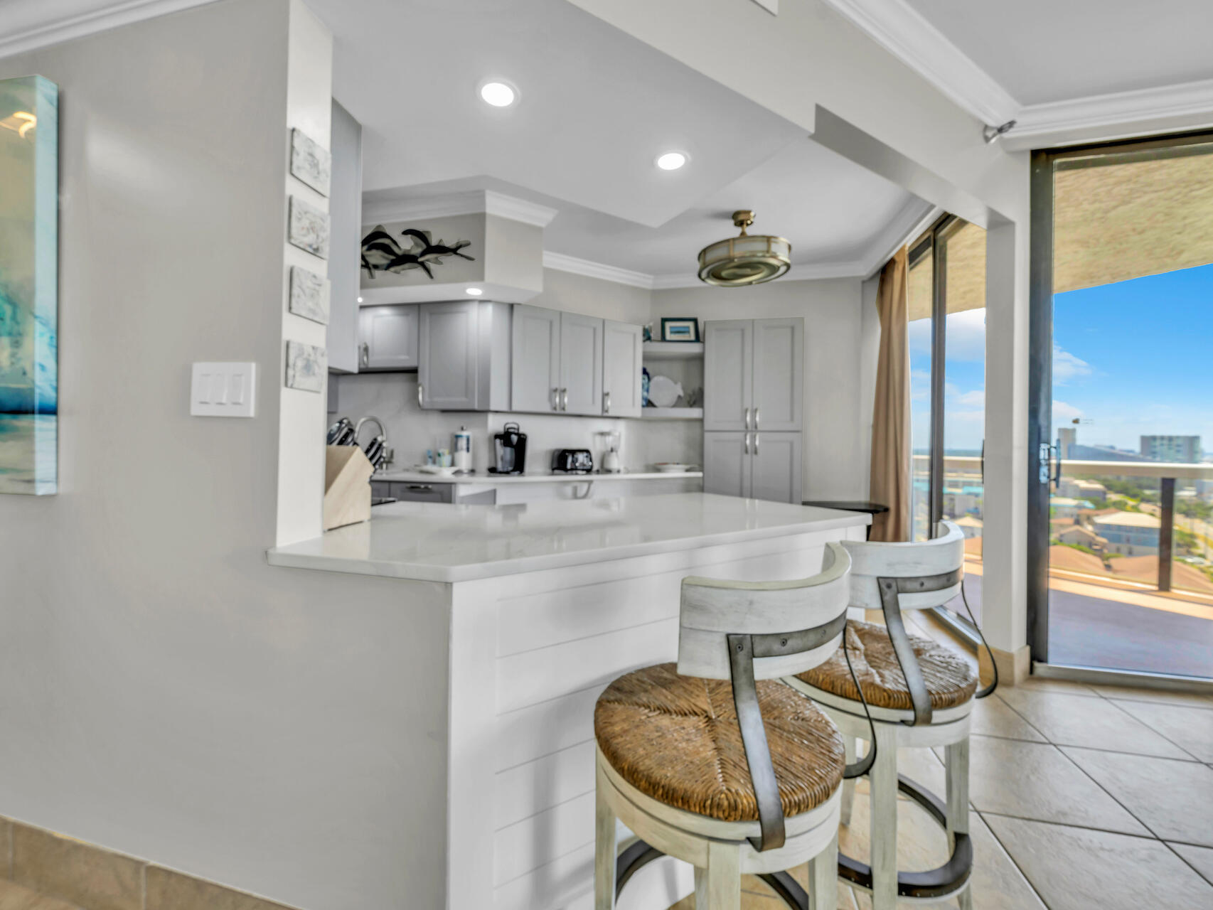 1096 Scenic Gulf Drive, Unit 1401/1401A Miramar Beach, FL 32550 - Photo 18 of 77 a kitchen with stainless steel appliances a sink and cabinets