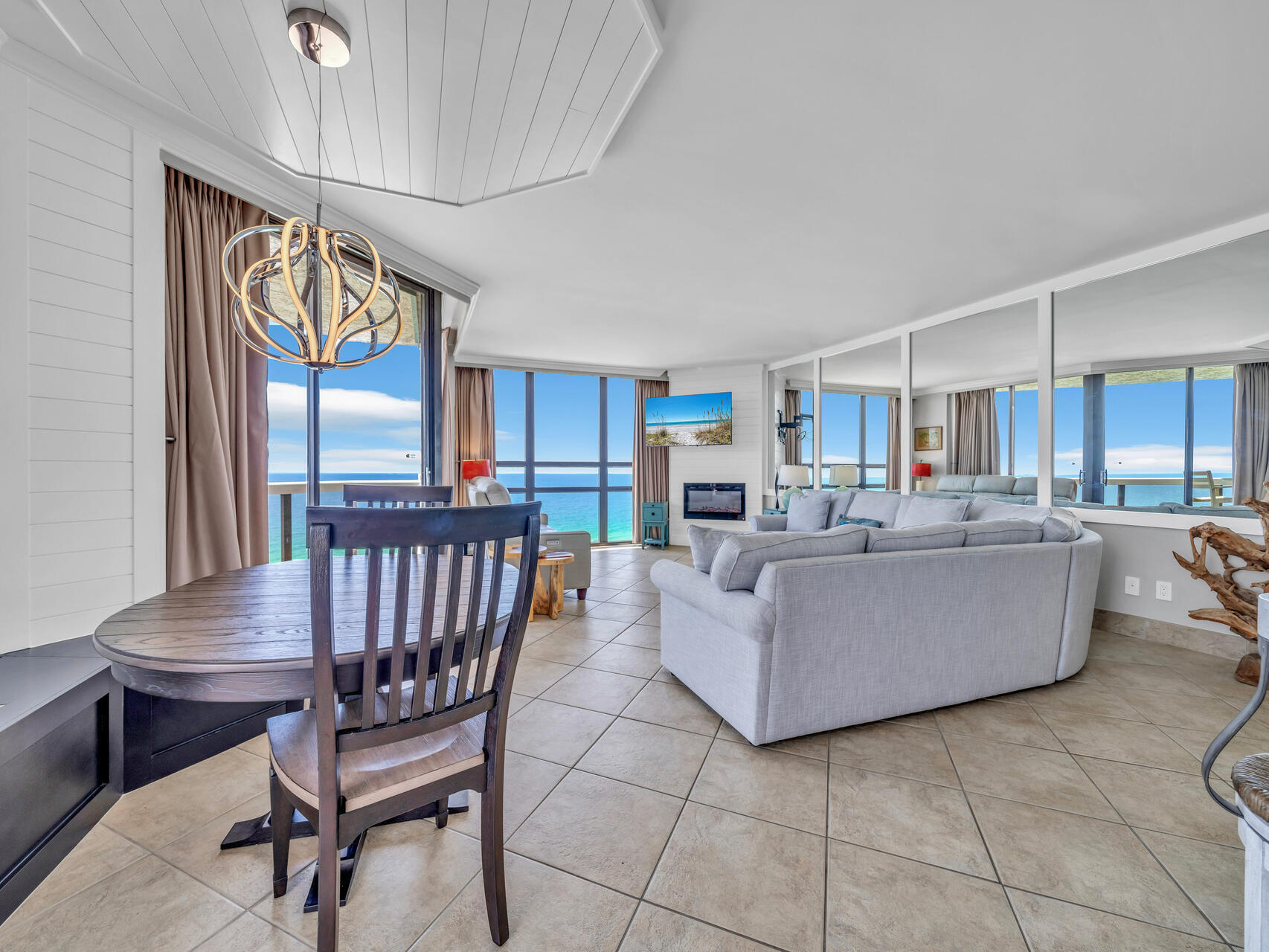 1096 Scenic Gulf Drive, Unit 1401/1401A Miramar Beach, FL 32550 - Photo 22 of 77 a living room with furniture a large window and a table