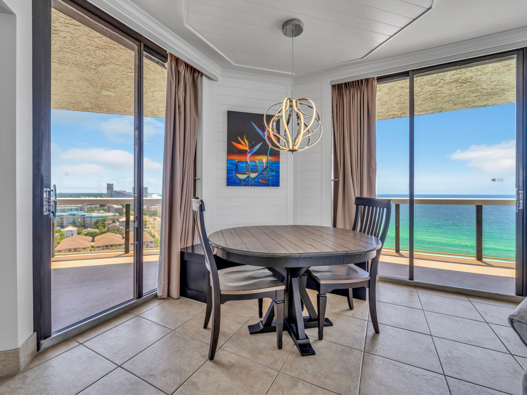 1096 Scenic Gulf Drive, Unit 1401/1401A Miramar Beach, FL 32550 - Photo 23 of 77 a view of a dining room with furniture large window and outside view