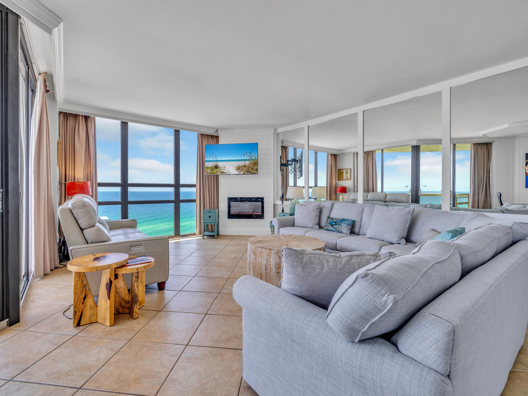 1096 Scenic Gulf Drive, Unit 1401/1401A Miramar Beach, FL 32550 - Photo 24 of 77 a living room with furniture and a fireplace