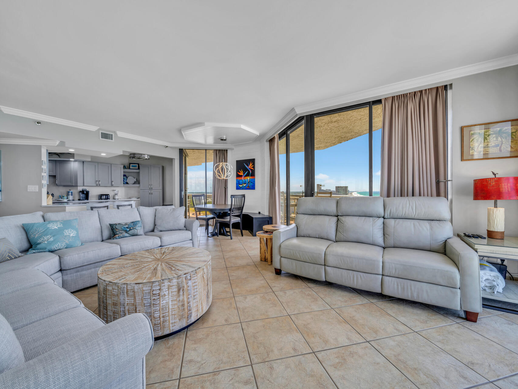 1096 Scenic Gulf Drive, Unit 1401/1401A Miramar Beach, FL 32550 - Photo 26 of 77 a living room with furniture and a large window