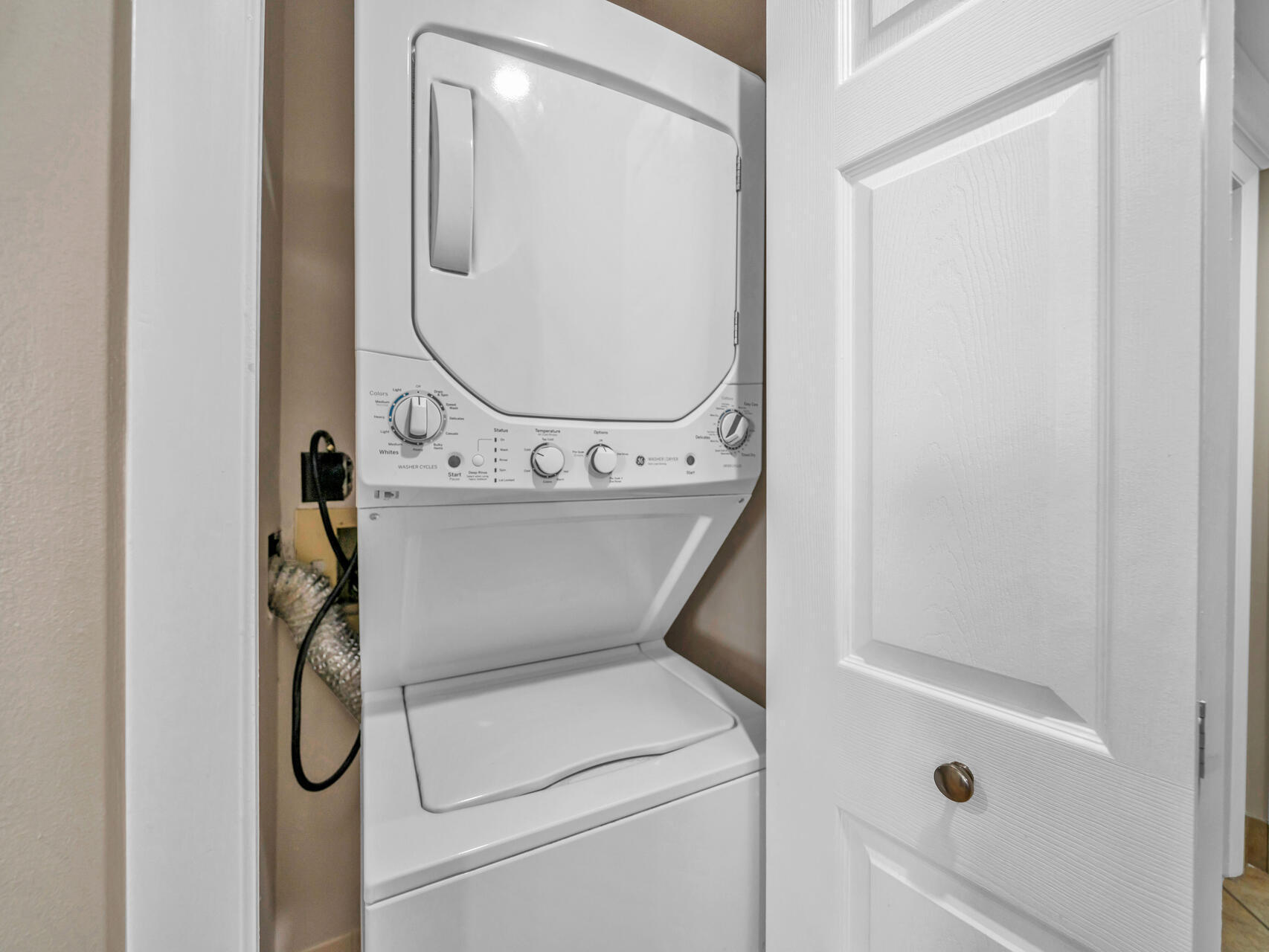 1096 Scenic Gulf Drive, Unit 1401/1401A Miramar Beach, FL 32550 - Photo 28 of 77 a utility room with dryer and washer