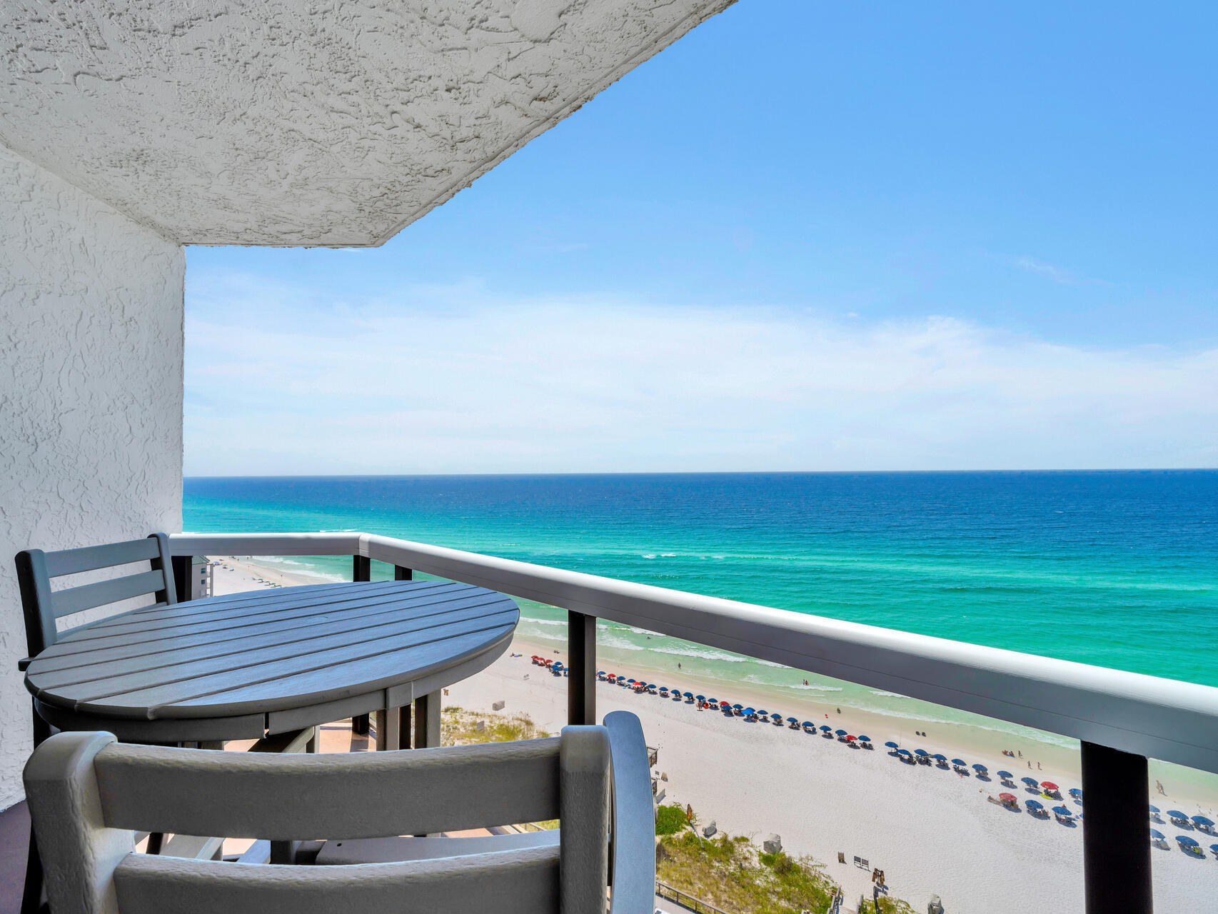 1096 Scenic Gulf Drive, Unit 1401/1401A Miramar Beach, FL 32550 - Photo 31 of 77 a wooden floor with a table and chairs