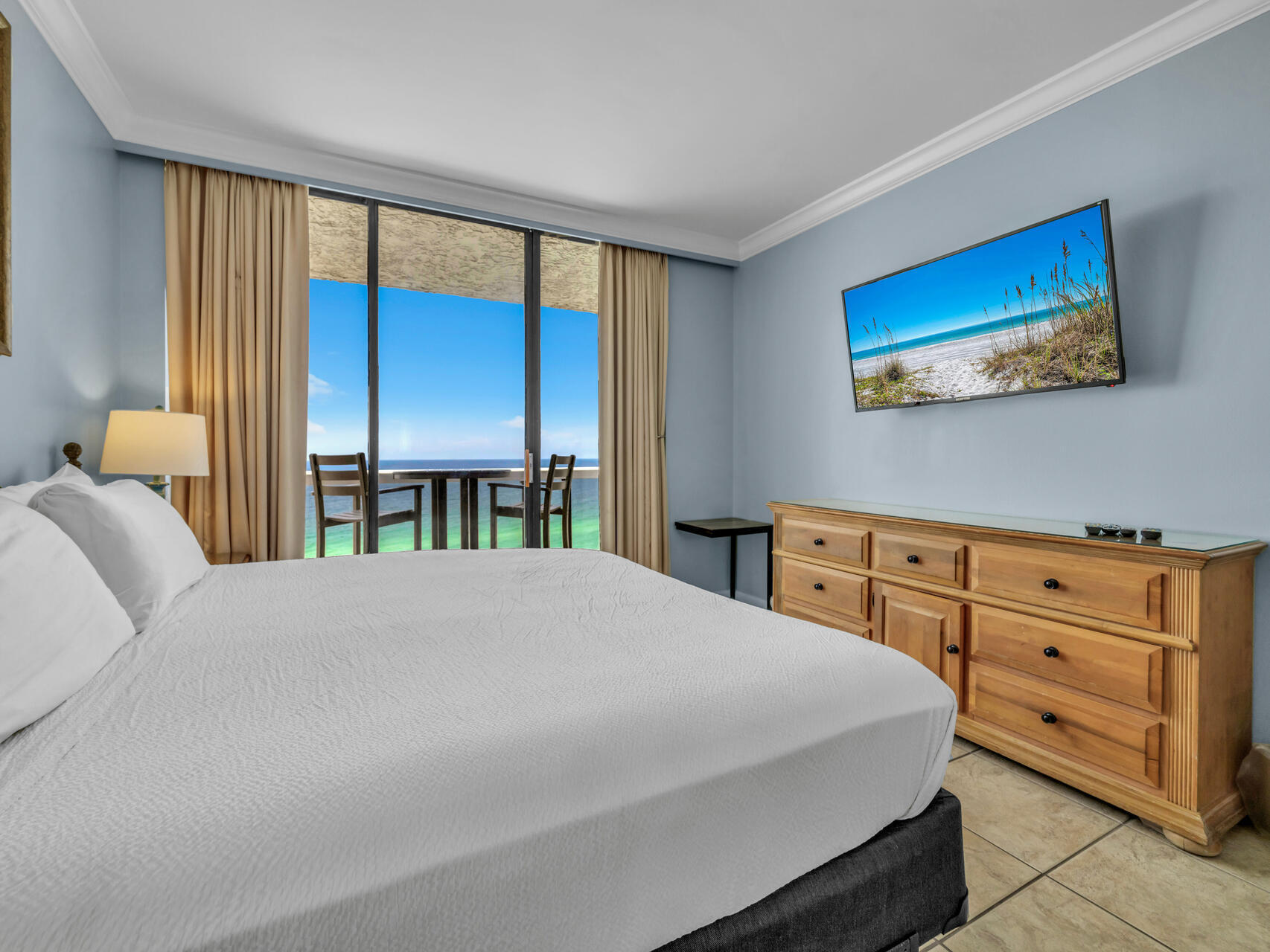 1096 Scenic Gulf Drive, Unit 1401/1401A Miramar Beach, FL 32550 - Photo 36 of 77 a bedroom with a bed and a window