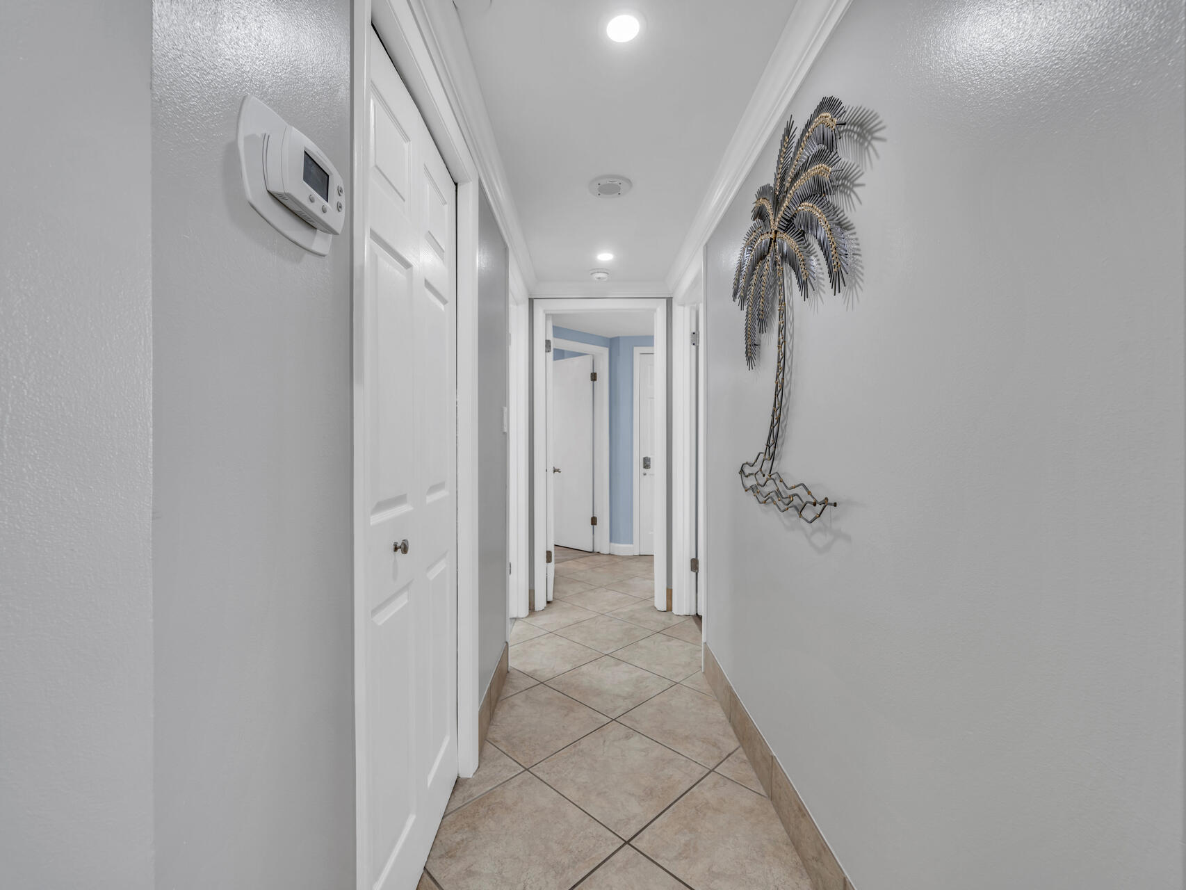 1096 Scenic Gulf Drive, Unit 1401/1401A Miramar Beach, FL 32550 - Photo 7 of 77 a view of a hallway with wooden floor and staircase